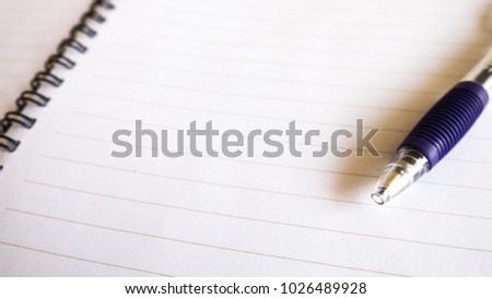blank notebook with pen 16:9 background.
