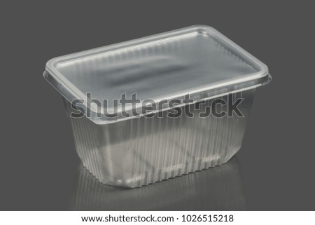 Plastic container on a gray background