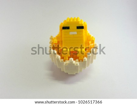 Egg figure sit in his shell Withe background