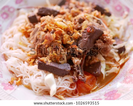 Close up of rice noodles with spicy pork sauce, so called 'Kanom Jeen Nam Ngeaw' in Thai language, local food in the North of Thailand