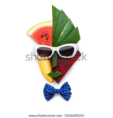 Creative concept of cubist style female face in sunglasses made of fruits and vegetables, on white background. Royalty-Free Stock Photo #1026600265