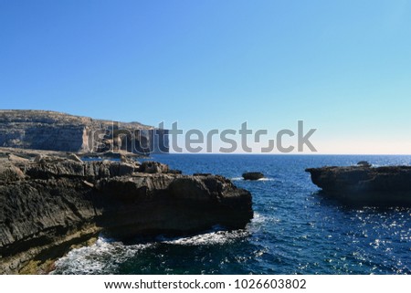 Beautiful wonderful stunning view near the Azure Window, Gozo island, Malta. Space for text. Skyline, sea ocean, cliffs, rocks, azure water, waves, white, summer travelling, swimming, enjoy, panorama