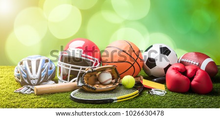 Close-up Of Various Sport Equipments On Pitch Against Bokeh Background Royalty-Free Stock Photo #1026630478
