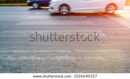 Cars driving on city streets Of one morning.