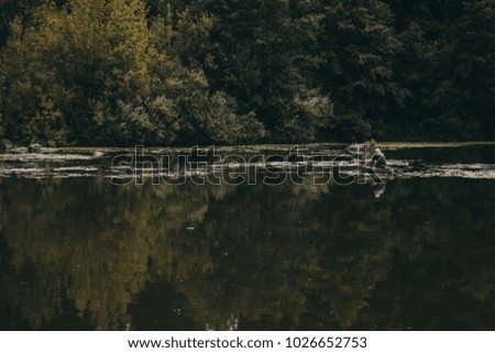 Young fisherman in a boat