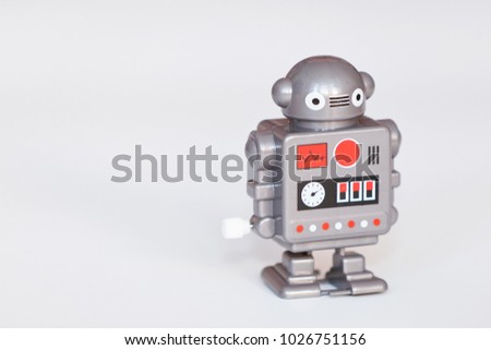 toy robot figure isolated on bright background