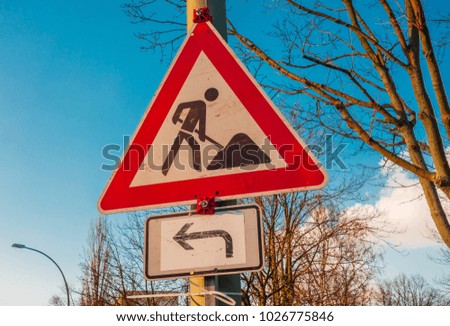 building site sign with small arrow in winter