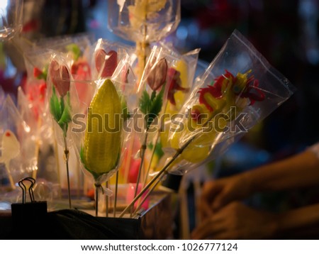 23 Dec'17 Surin Province Thailand : Candy Mold was Made from Sugar in Chinese Opera Celebration of The City Pillar Shrine in front of The Country Train Station