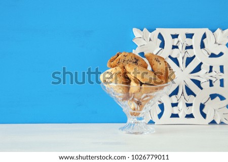 Purim celebration concept (jewish carnival holiday). Traditional hamantaschen cookies
