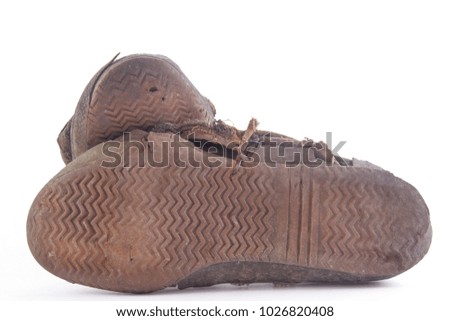 Black and white sneakers dirty isolated on white background, Footwear for outdoor activities, clipping path done using pen tool.