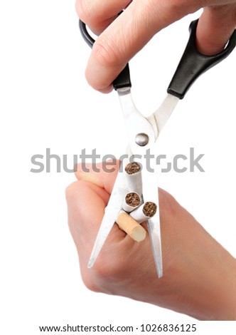 cigarette with scissors stock photo