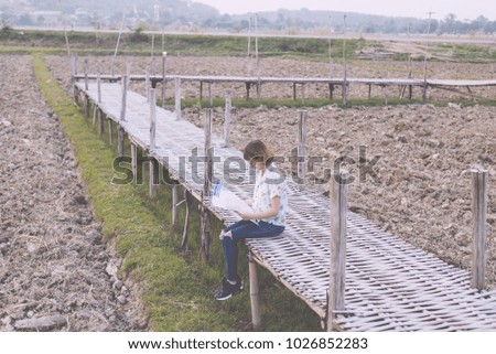 Woman sightseeing outdoors and holding a map