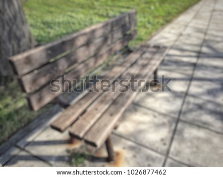 blurred background with an empty bench