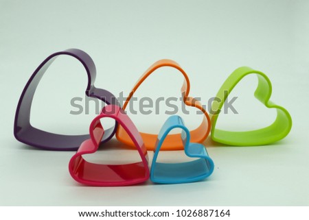 multicolored forms of hearts on a white background