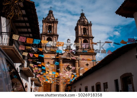 Old church at Valle de Bravo Mexico. San Francisco de Asís Church al Independence square in Bravo Valley. Traditional culture in a Magic town in Mexico.  Royalty-Free Stock Photo #1026918358