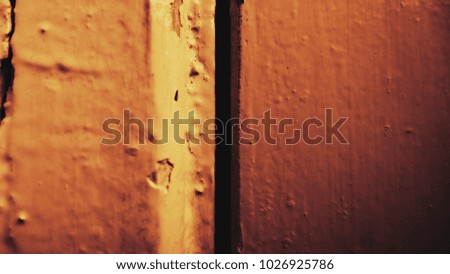 abstract art background. vibrant yellow old painted wooden surface.