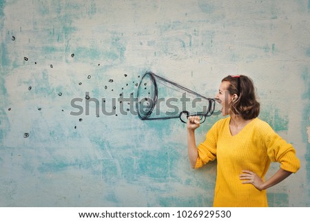 speaking loudly in the megaphone Royalty-Free Stock Photo #1026929530
