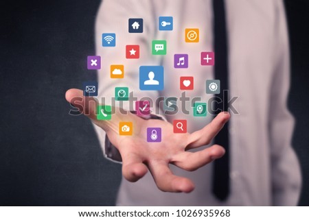 Colorful multimedia icons in the hands of a businessman
