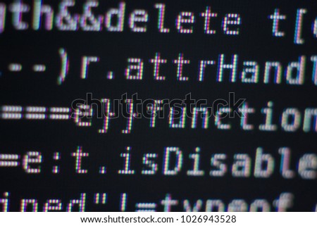 White Program Source Code Segment on Black Screen Macro Closeup