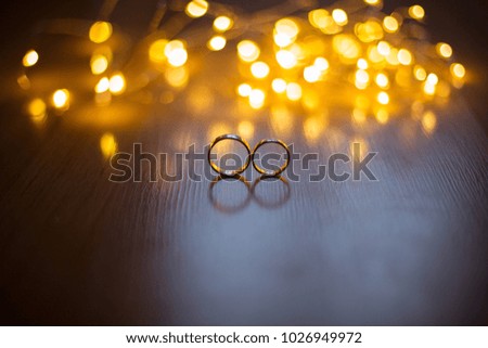 Rings on colorful shiny yellow background.