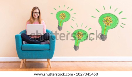 Eco Energy with young woman using her laptop in a chair
