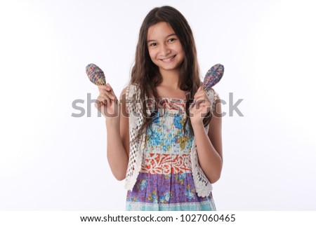 Thai american hair girl wearing a long bright color dress shaking sakura looking at the camera on a white background