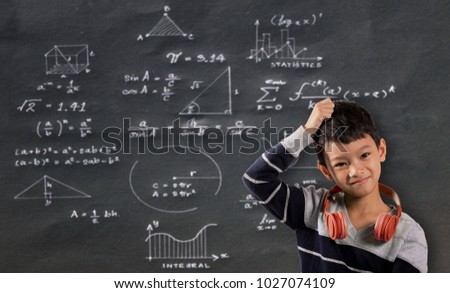 Asian boy not understand math geometry formulas on black background.