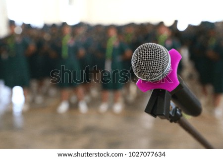 Microphone stand with scout blur background