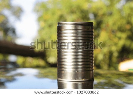 Empty metal tin can with blurred background in outdoor