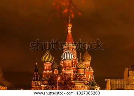 Picture of cathedral with colorful domes on background of dark sky