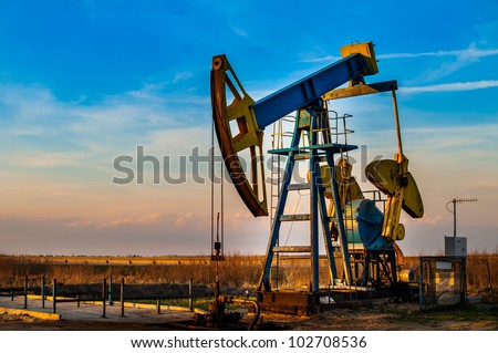 Oil pump. Oil industry equipment. Royalty-Free Stock Photo #102708536