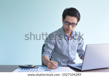 asian businessman is working in office