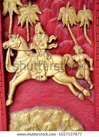Carving on the church door in Wat Sawaniweth Thailand Phrae province. Siddhartha came with Channa holding on to Kanthaka's tail, rode away from Kapilavatthu city.