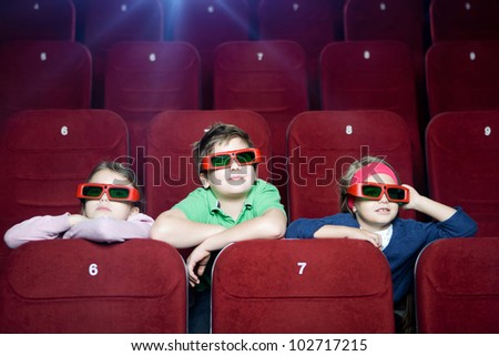 Kids watching 3D cartoon in the movie theater