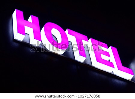 Pink & white stylish hotel text written on a electronic advertising board stock photo