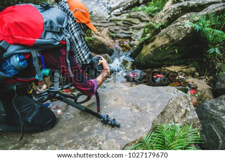 Photographer asian women Traveling photograph Nature. travel relax in the holiday walk in the forest. travel relax in the holiday.  Thailand 