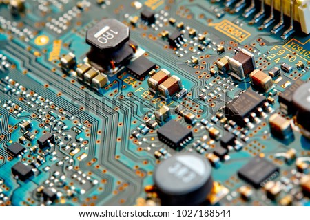 Electronic circuit board close up. Royalty-Free Stock Photo #1027188544