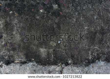Abstract of grunge old dark dirty cement wall for background using.