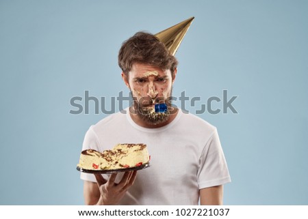  a celebration, a man with a cake on a blue background, a birthday                              