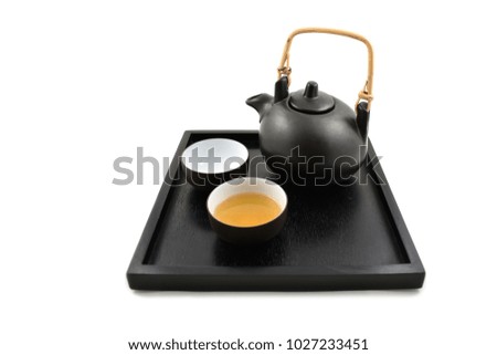 Brown tea service stock images. Asian tea service on a white background. Cup of green tea. Chinese tea cup