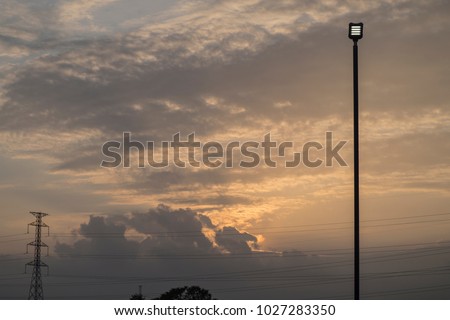 solar cell lamp side of road and sunset background