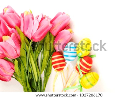 Easter eggs, tulips on vintage blue wood background
