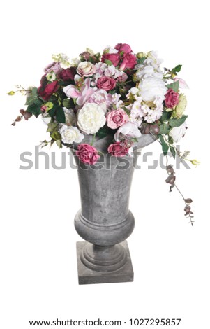 Celebratory flower arrangement in a ceramic vase isolated on a white background.