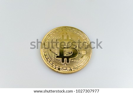 An isolated bitcoin on a white background