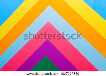 Multi colored abstract paper of pastel colors, with geometric shape, flat lay. 