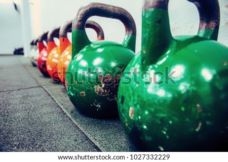 colorful used and old kettle bells, workout equipment