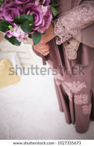 Beautiful wedding bouquet in bride's hand. Selective focus.
