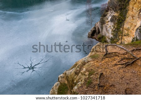 Adrspach national mountain park. Frozen lake and cliffs