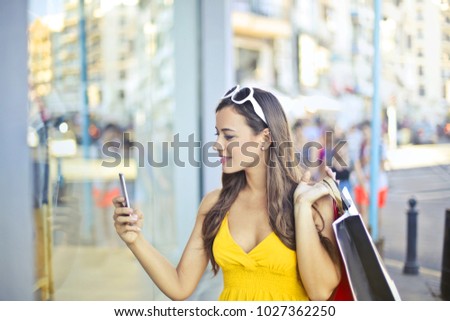 Stylish woman taking a picture