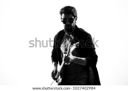 musician plays electric guitar                               